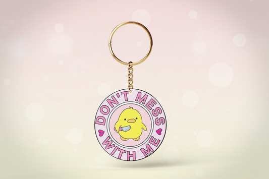 Keychain with cartoon duck and text 'Don't Mess with Me' on a white background