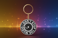 Keychain with 'Don't Stop The Music' text on a white background