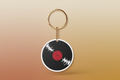 Keychain with vinyl record design on a white background
